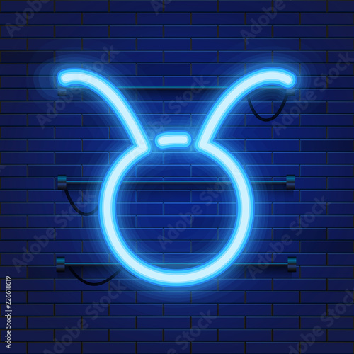 Blue shining cosmic neon zodiac Taurus symbol on brick wall background. Astrology concept. Vector illustration.