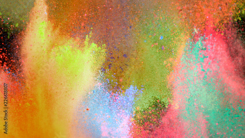 Multi-color powder explosion on black background