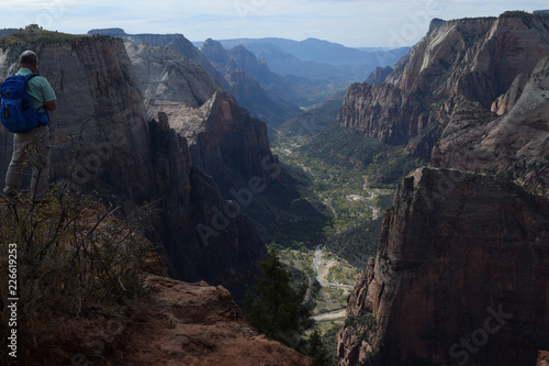 Hiker at a Peak in Zion National Park