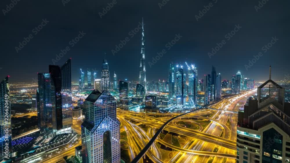 Night aerial panoramic Hyperlapse time lapse of Dubai over the Highway, traffic, Burj Khalifa in the background Night aerial panoramic Hyperlapse time lapse of Dubai over the Highway, traffic, Burj Khalifa in the background