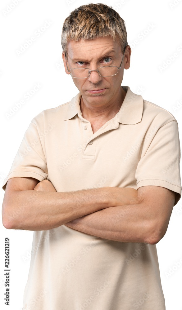 Casually dressed man with his arms folded in front of him Casually dressed man with his arms folded in front of him