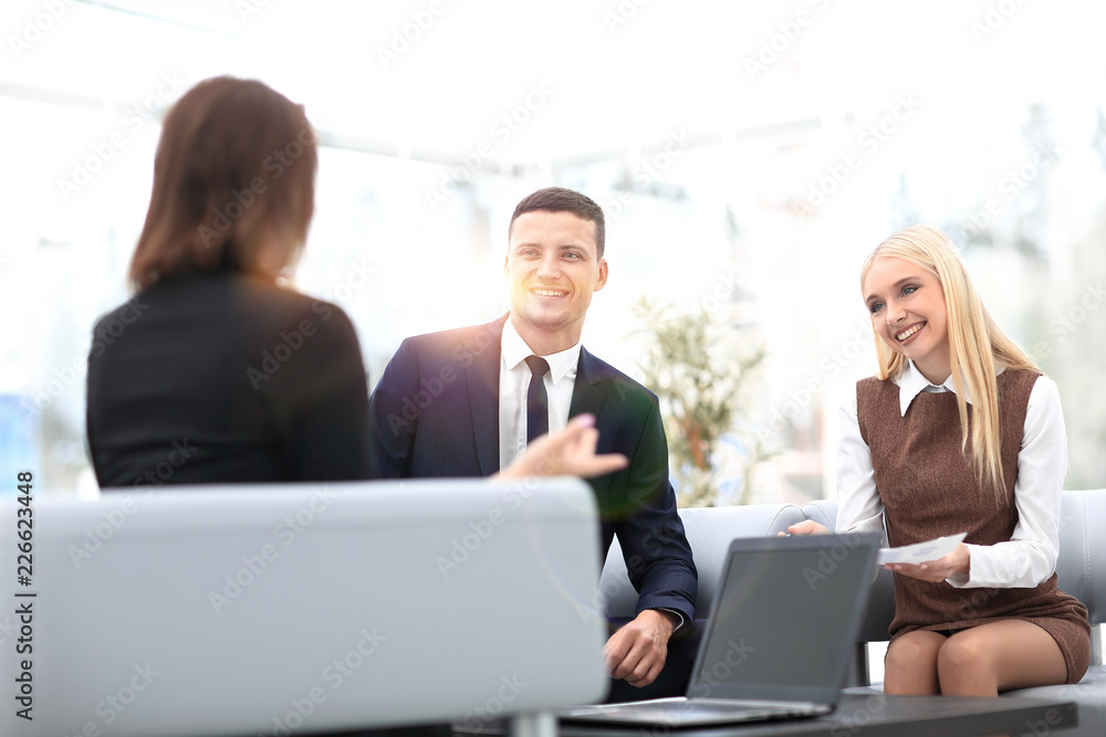 business team discussing business issues in office business team discussing business issues in office