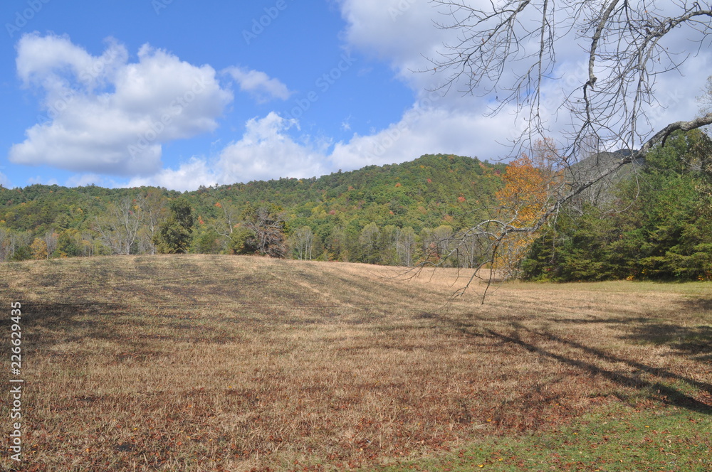 Fototapeta premium Mountains in October Fields are cut hay is stored.