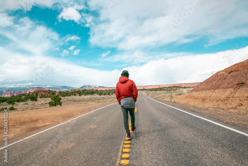 Man walking on road in Utah