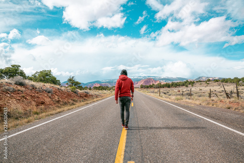 Man walking on road in Utah