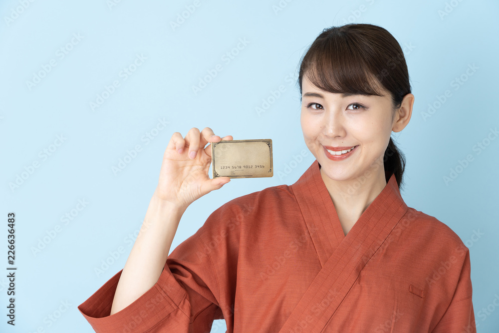portrait of japanese style waitress isolated on blue background portrait of japanese style waitress isolated on blue background