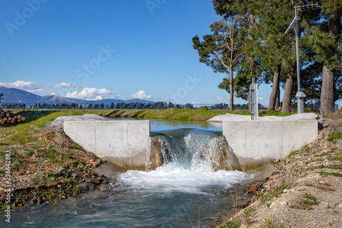 An canal weir on the central plains water irrigation system in Canterbury, New Zealand photo