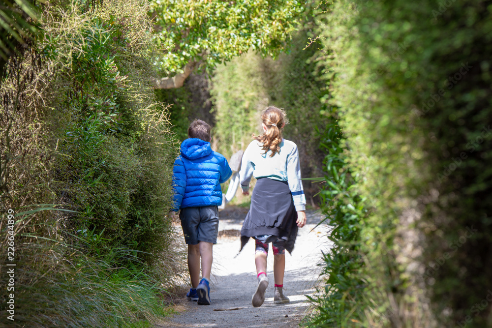 Two unidentified children spend their spring holidays being fit and active walking and exploring the outdoors