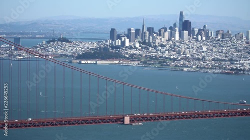 Downtown San Francisco from the Marin Headlands.  Bridge foreground, light weekend traffic.  Clear fall afternoon.    East Bay Hills visible in the background.