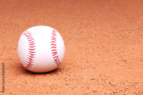 A baseball on dirt