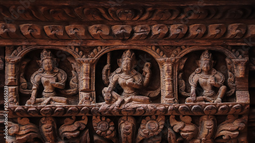 Wallpaper Mural Statue of Hindu Gods carved on the wooden door Torontodigital.ca