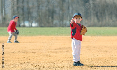 Young Baseball Player Giving a Thumbs Up