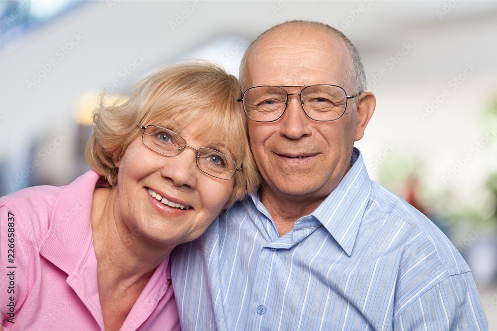 Portrait of happy senior couple smiling at Portrait of happy senior couple smiling at