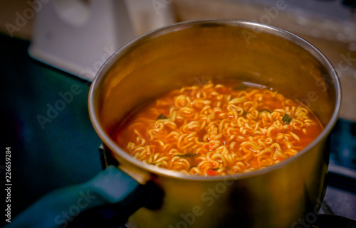 A bowl of rosy Korean noodles