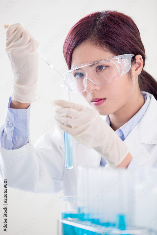 woman scientist take test tube woman scientist take test tube