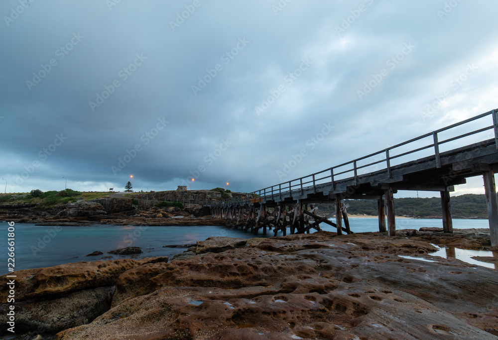 A bridge from Bare Island to La Perouse in a cloudy day. Sydney, Australia.