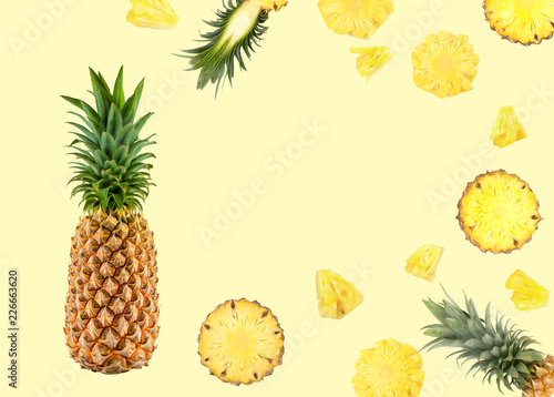 natural fresh fruit background of pineapple on yellow background