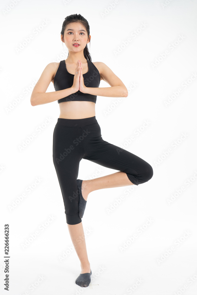 Sporty young asian woman doing yoga practice isolated on white background - concept  healthy life  fitness for slim.