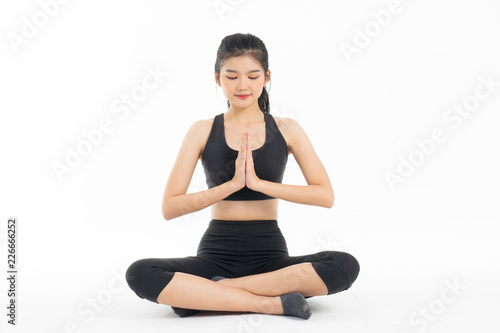 Sporty young asian woman doing yoga practice isolated on white background - concept healthy life fitness for slim.