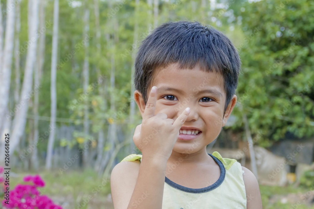 Asian little boy show hand symbol of love Asian little boy show hand symbol of love