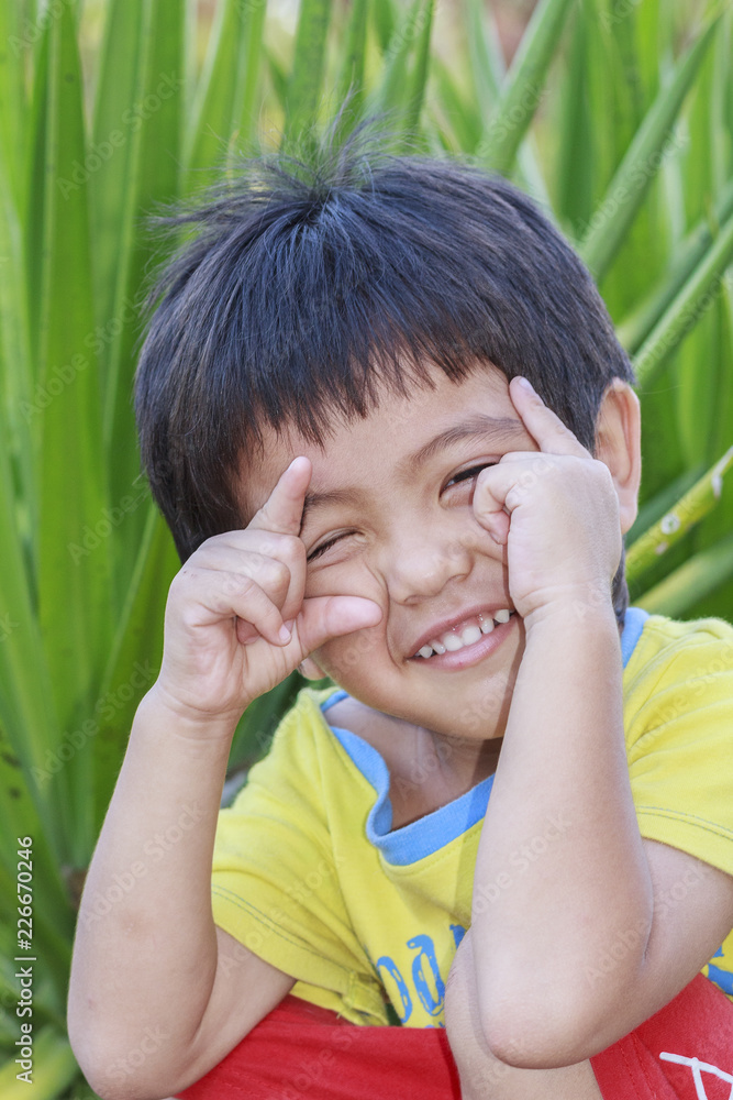 Portrait of happy cute Asian Thai little boy