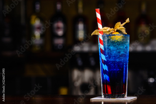 Blue cocktail on the bar tender