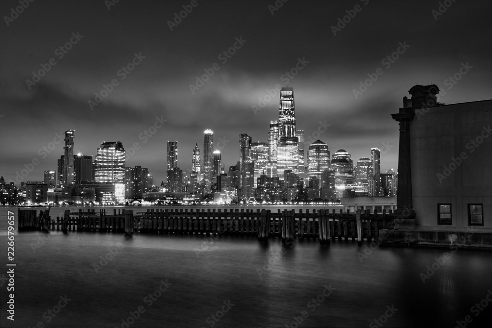Manhattan midtown skyline at twilight over Hudson river , New York City