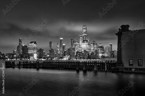 Manhattan midtown skyline at twilight over Hudson river , New York City