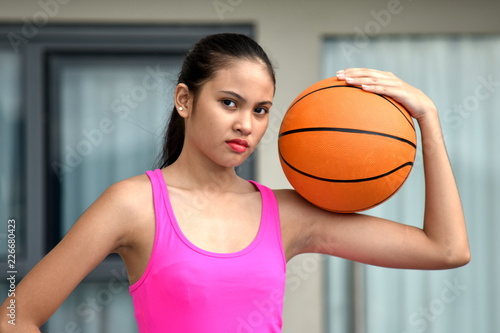 Serious Athletic Person With Basketball