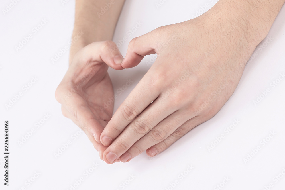 Fototapeta premium male hands showing the gesture of the heart.