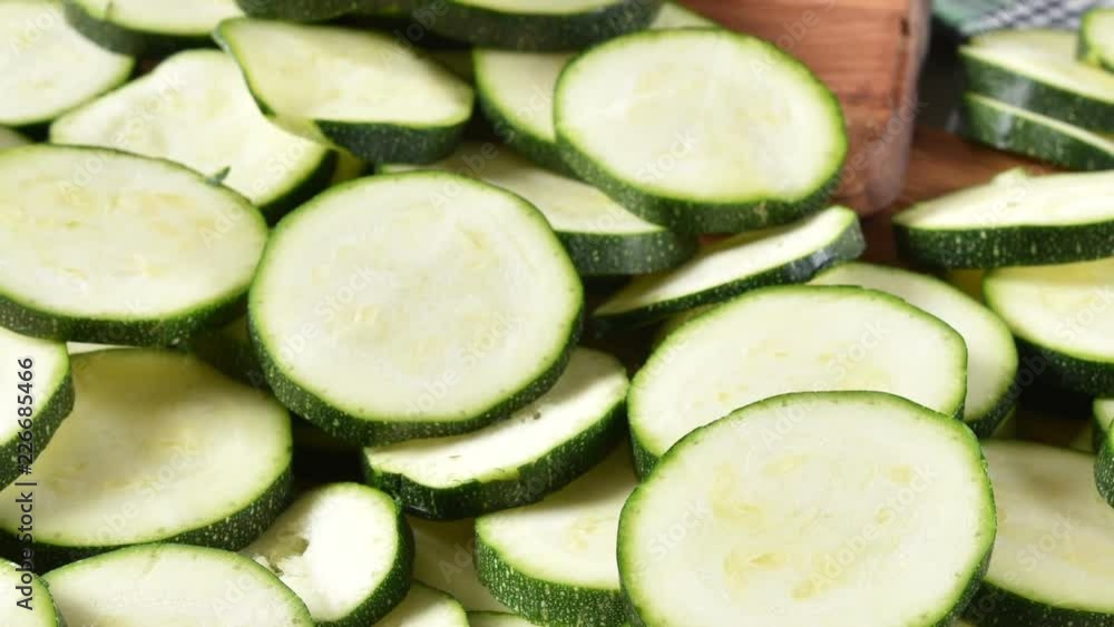 High angle view of sliced zucchini on a cutting board
High angle view of sliced zucchini on a cutting board