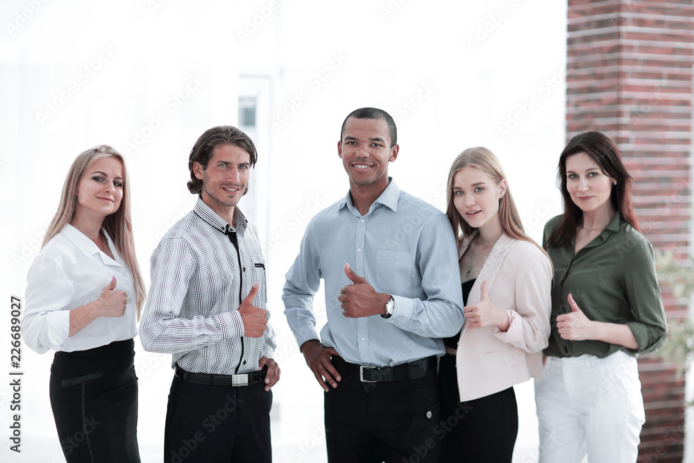 successful multinational business team showing thumb up successful multinational business team showing thumb up