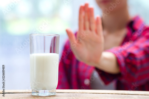 Canvastavla A woman feels bad, has an upset stomach, bloating due to lactose intolerance