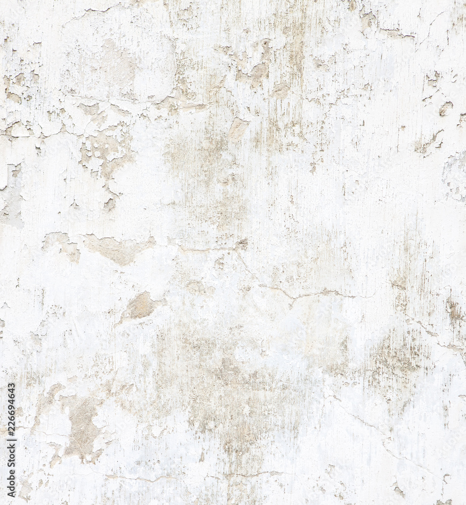 White concrete wall with peeling paint. Grunge background.
