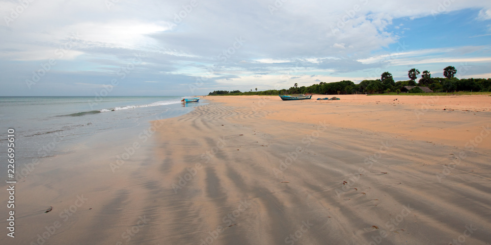 Beached boat on Nilaveli beach in Trincomalee Sri Lanka Asia