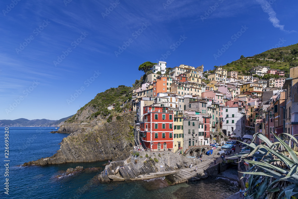 Beautiful view of Riomaggiore on a sunny summer day, Cinque Terre, Liguria, Italy