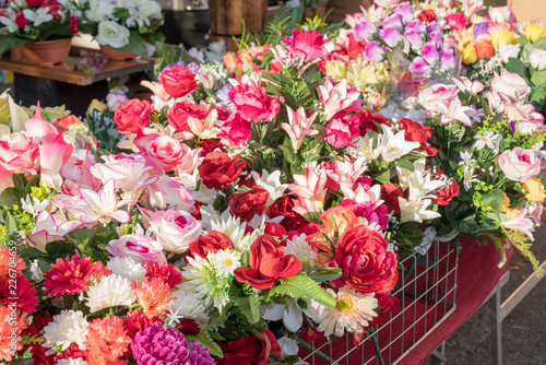 Various and beautiful colorful plastic flowers,decorative flowers, sold at the market