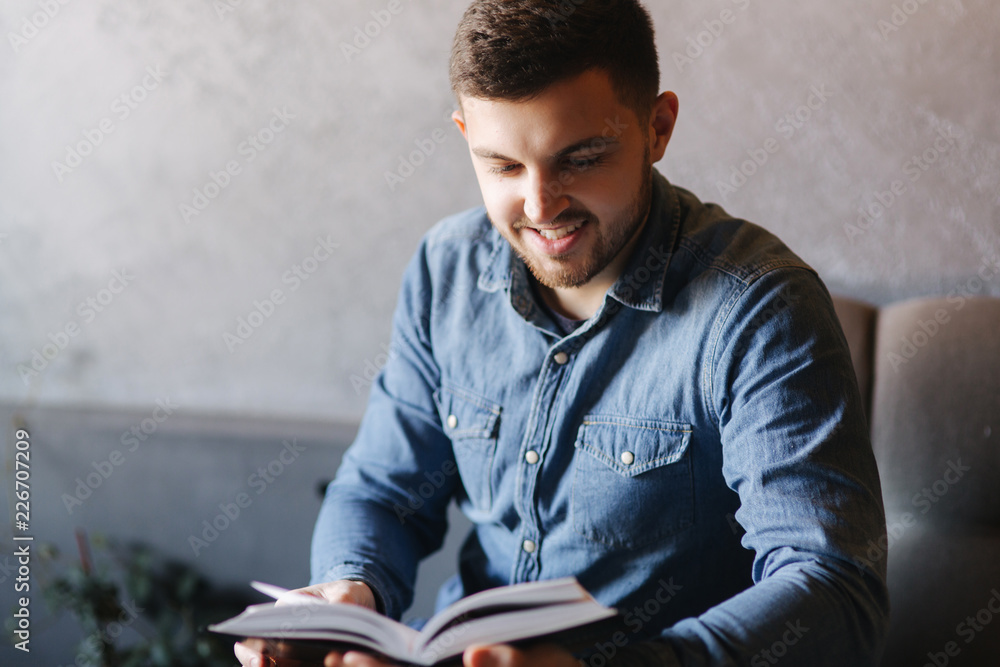 Student read book in cafe. Study and education Student read book in cafe. Study and education