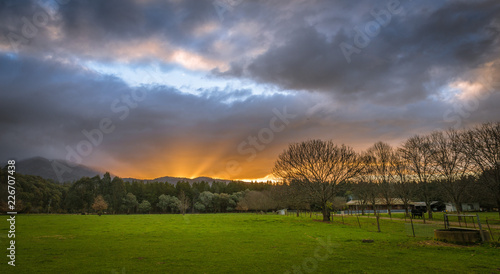 Australian countryside farming agriculture panoramic landscape with dramatic clouds at sunset