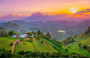 Kisoro Uganda beautiful sunset over mountains and hills of pastures and farms in villages of Uganda. Amazing colorful sky and incredible landscape to travel and admire the beauty of nature in Africa