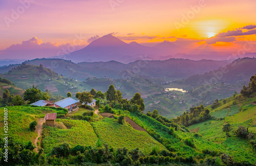 Kisoro Uganda beautiful sunset over mountains and hills of pastures and farms in villages of Uganda. Amazing colorful sky and incredible landscape to travel and admire the beauty of nature in Africa photo