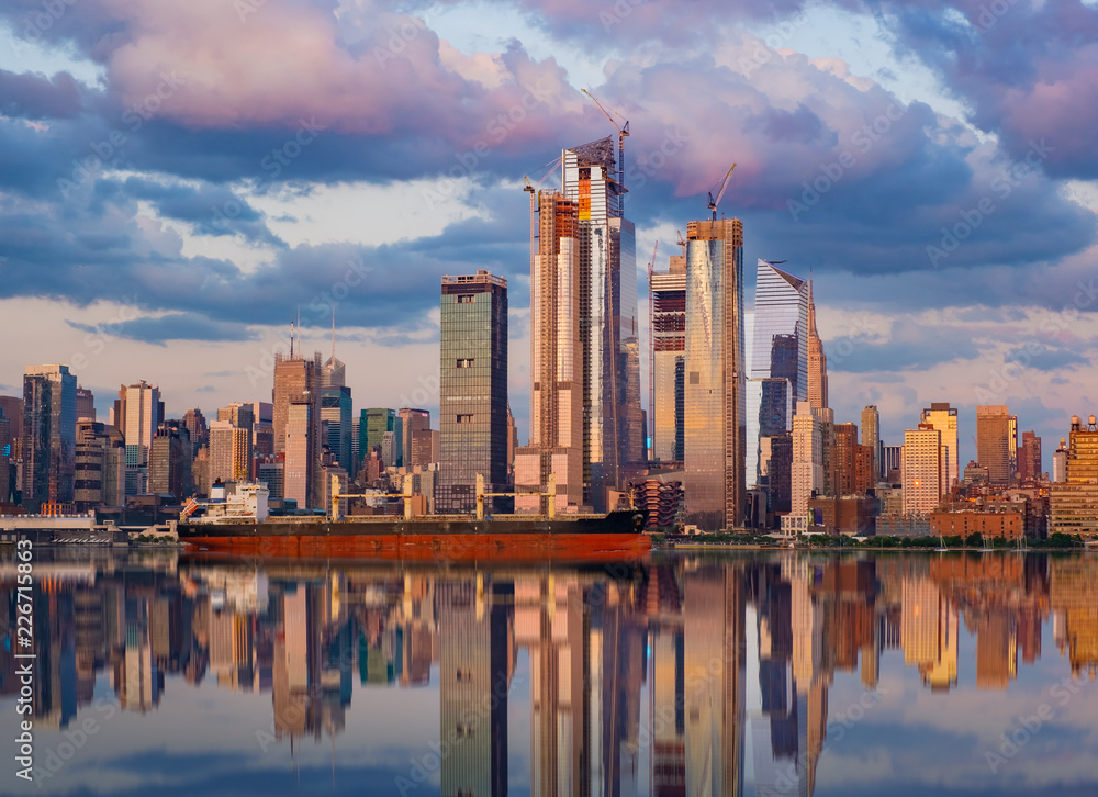 Fototapeta premium New York City, July 24, 2018 Manhattan Midtown skyline at dusk over Hudson River, New York City