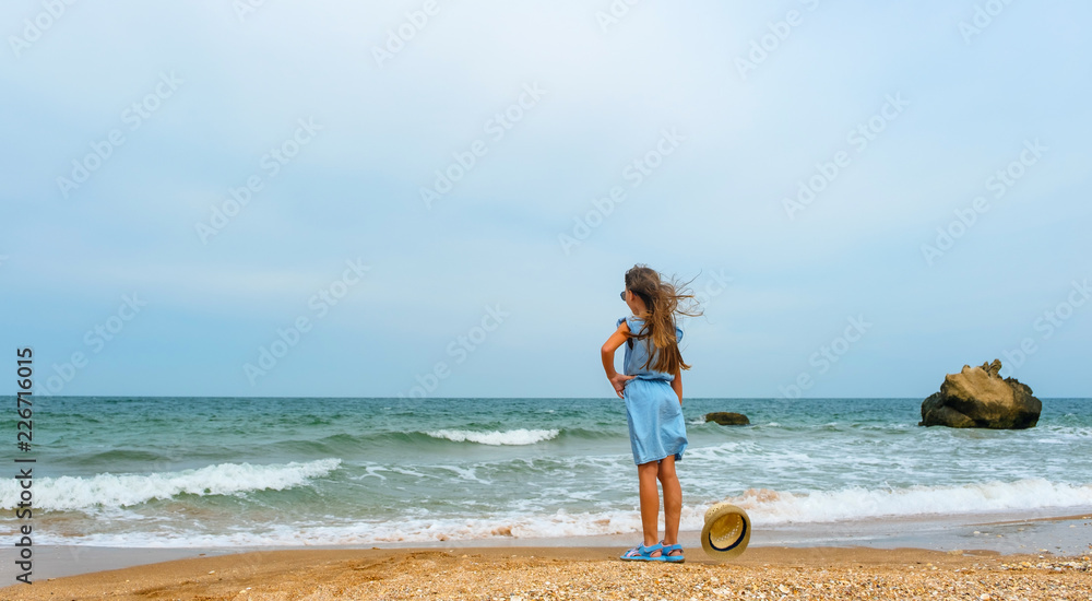 Little girl with hat on the beach Little girl with hat on the beach