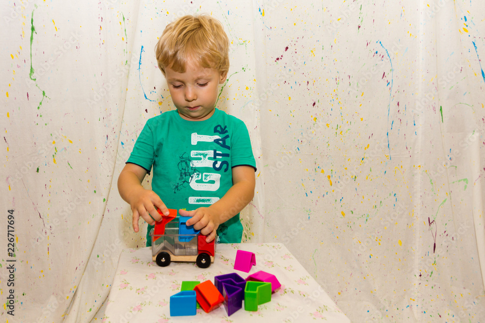 Fototapeta premium a small child plays an educational game