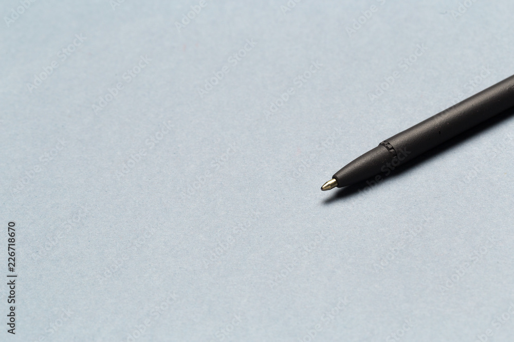Ballpoint pen showing communication contact us or mail concept on gray background Ballpoint pen showing communication contact us or mail concept on gray background