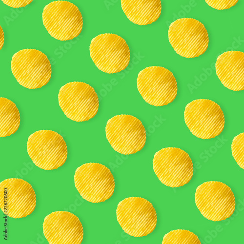 Potato chips pattern on pastel green background top view flat lay