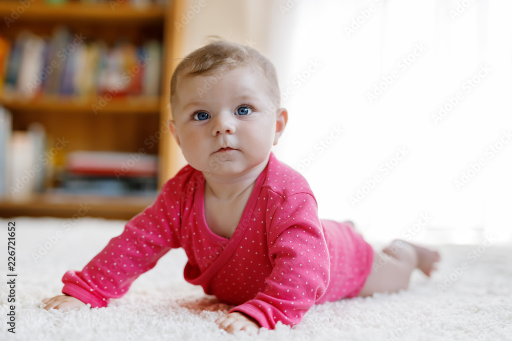 Portrait of little tiny baby girl of 5 months indoors at home Portrait of little tiny baby girl of 5 months indoors at home