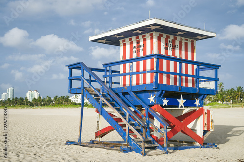 Classic red, white, and blue American flag themed lifeguard tower on the sand in South Beach, Miami, Florida, USA © lazyllama