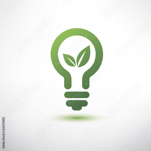 green eco energy concept, plant growing inside the green light bulb