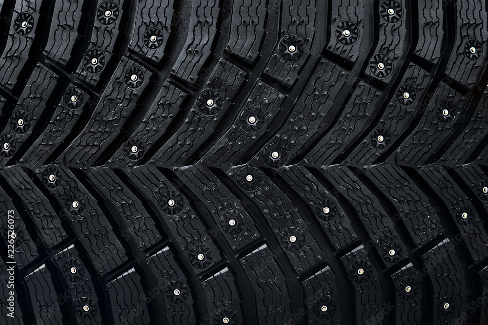 Stockfoto Wheel tire seamless pattern. A close up of a tire protector and  studs. Winter tyre texture. Realistic illustration. Black rubber, studs and  protector background | Adobe Stock